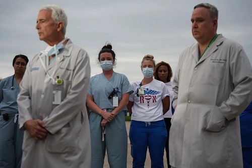nurses mourning victims in highland park