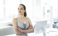 Woman sitting in office after workout