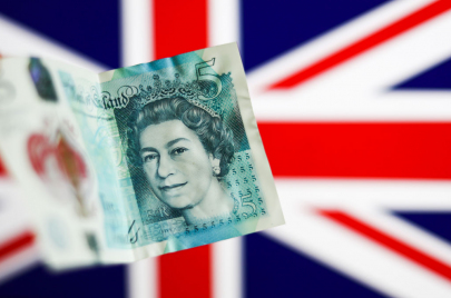 The Image Of The Queen Elizabeth II On Pound Banknote And Coins