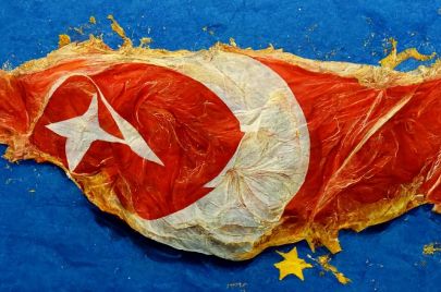 Turkey flag peeling into the EU flag