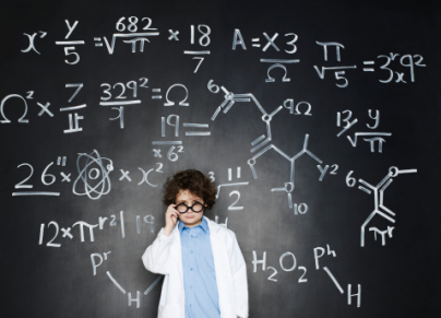 Boy as a professor with formulas behind him