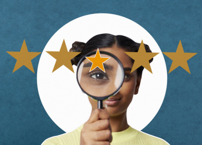 Woman looking through magnifying glass at 5 stars