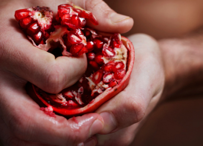man holding Pomegranate 