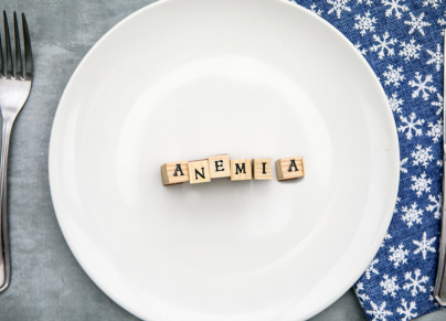 anemia written in wooden blocks in a ceramic plate,Top view