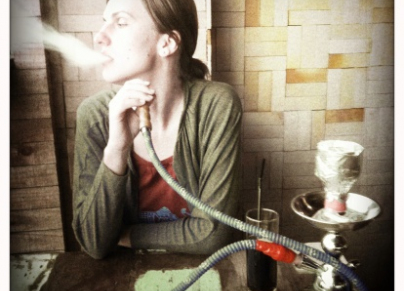 Young woman smoking shisha
